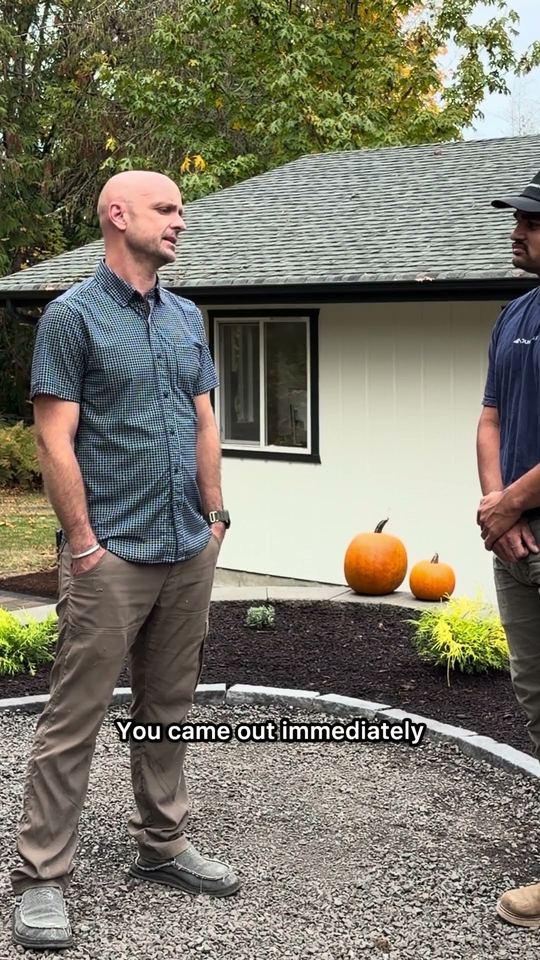 Warren talking with Darcy in front of his finished yard